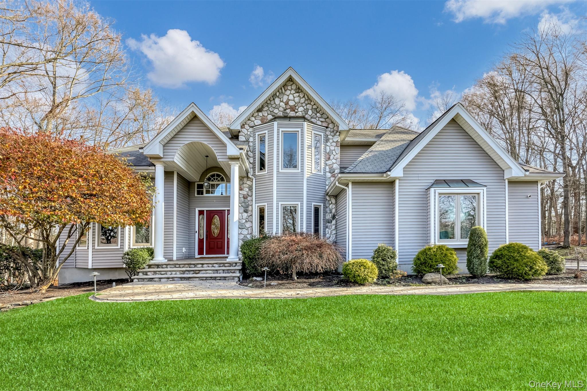 6 Wedge Way Suffern, NY 10901 - Photo 2 of 27 a front view of a house with garden and trees