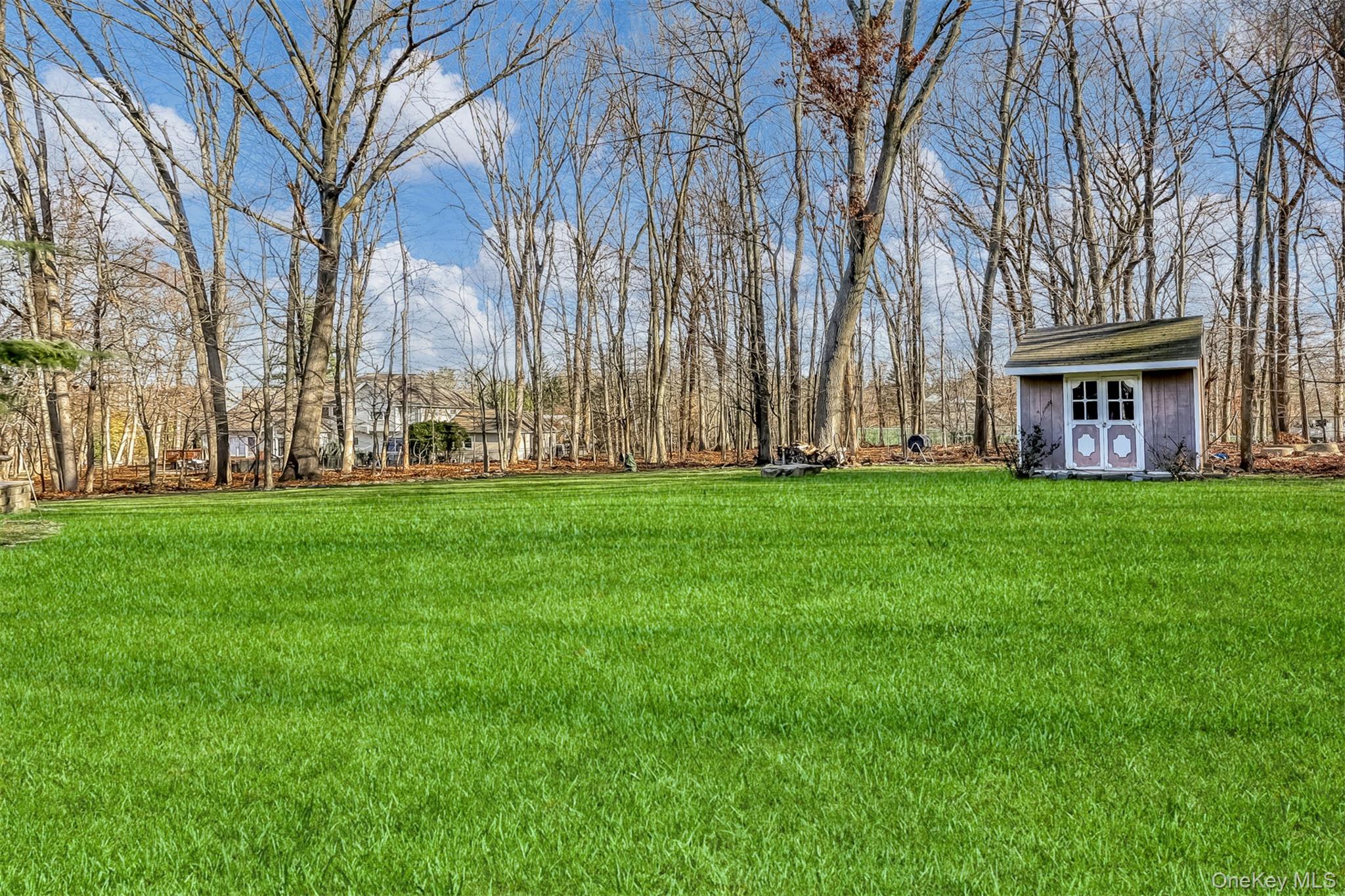 6 Wedge Way Suffern, NY 10901 - Photo 23 of 27 a garden with trees in front of it