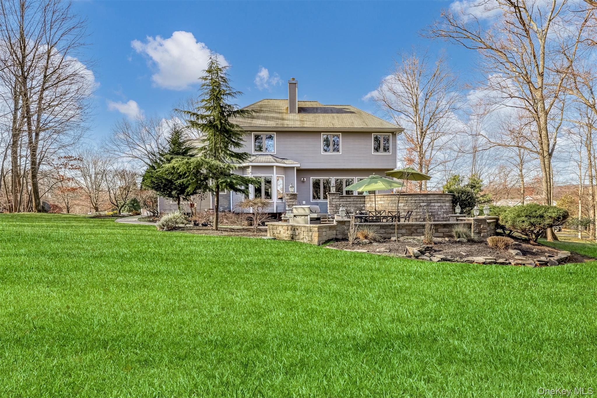 6 Wedge Way Suffern, NY 10901 - Photo 24 of 27 a front view of a building with garden