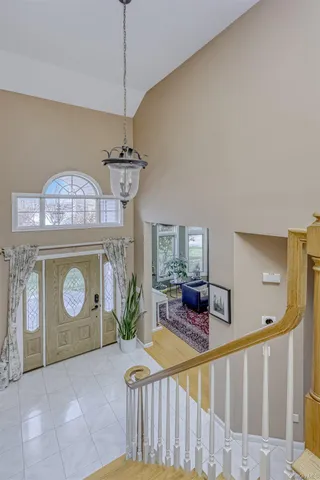 a view of a room with furniture and chandelier