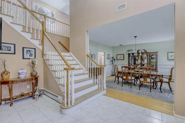 a view of a livingroom with furniture and stairs