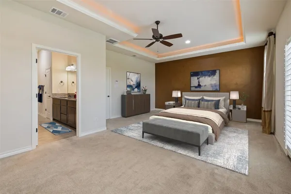 a bedroom with bed and a chandelier