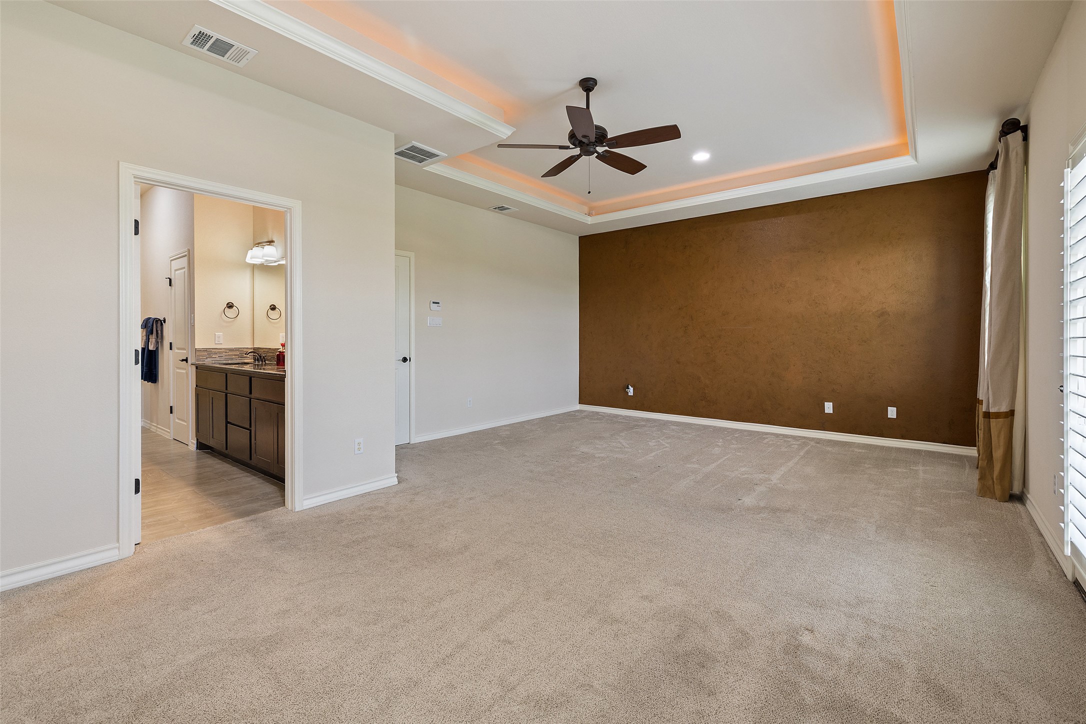 233 Adams Street Georgetown, TX 78628 - Photo 12 of 37 a view of a livingroom with a ceiling fan and entryway