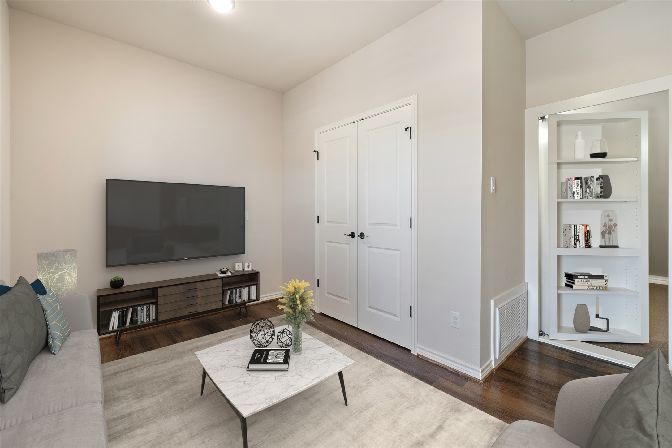 233 Adams Street Georgetown, TX 78628 - Photo 23 of 37 a living room with furniture and a flat screen tv