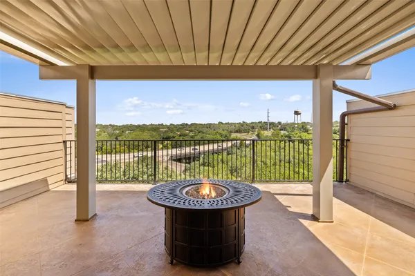 a view of a balcony with floor to ceiling window and stairs