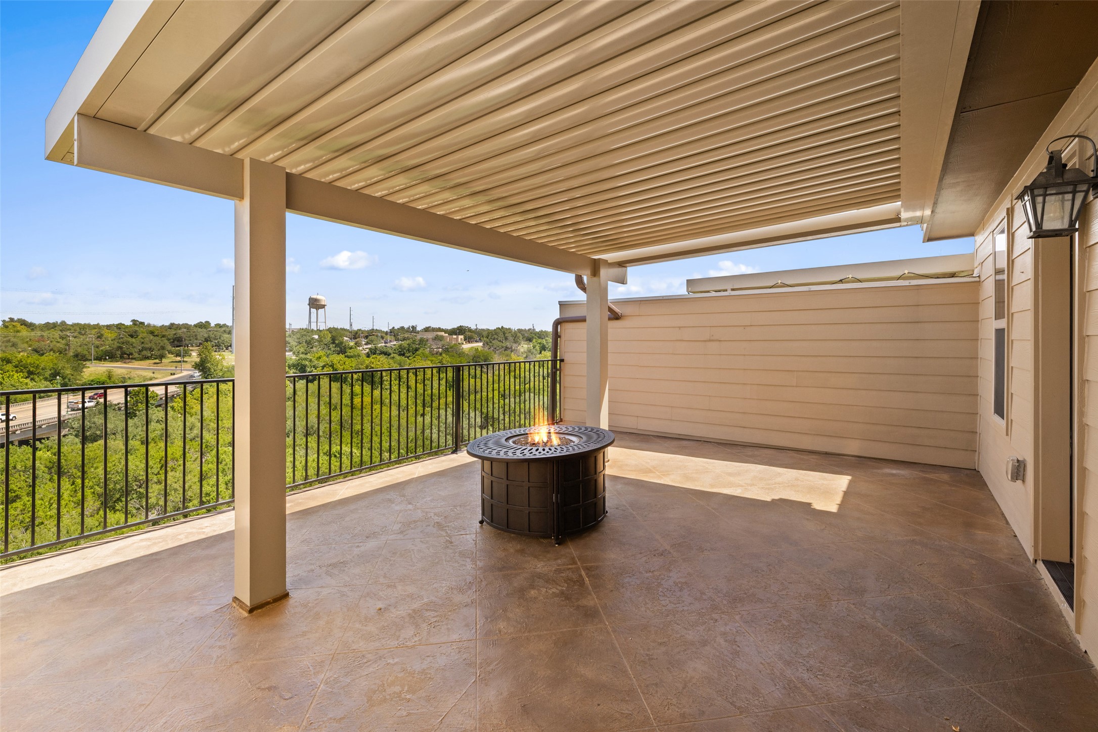 233 Adams Street Georgetown, TX 78628 - Photo 31 of 37 a view of a patio with a table and chairs and floor to ceiling window