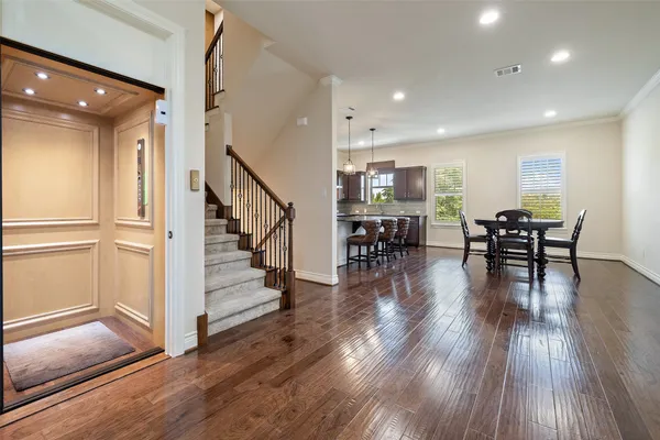 a view of dining room with furniture wooden floor and windows