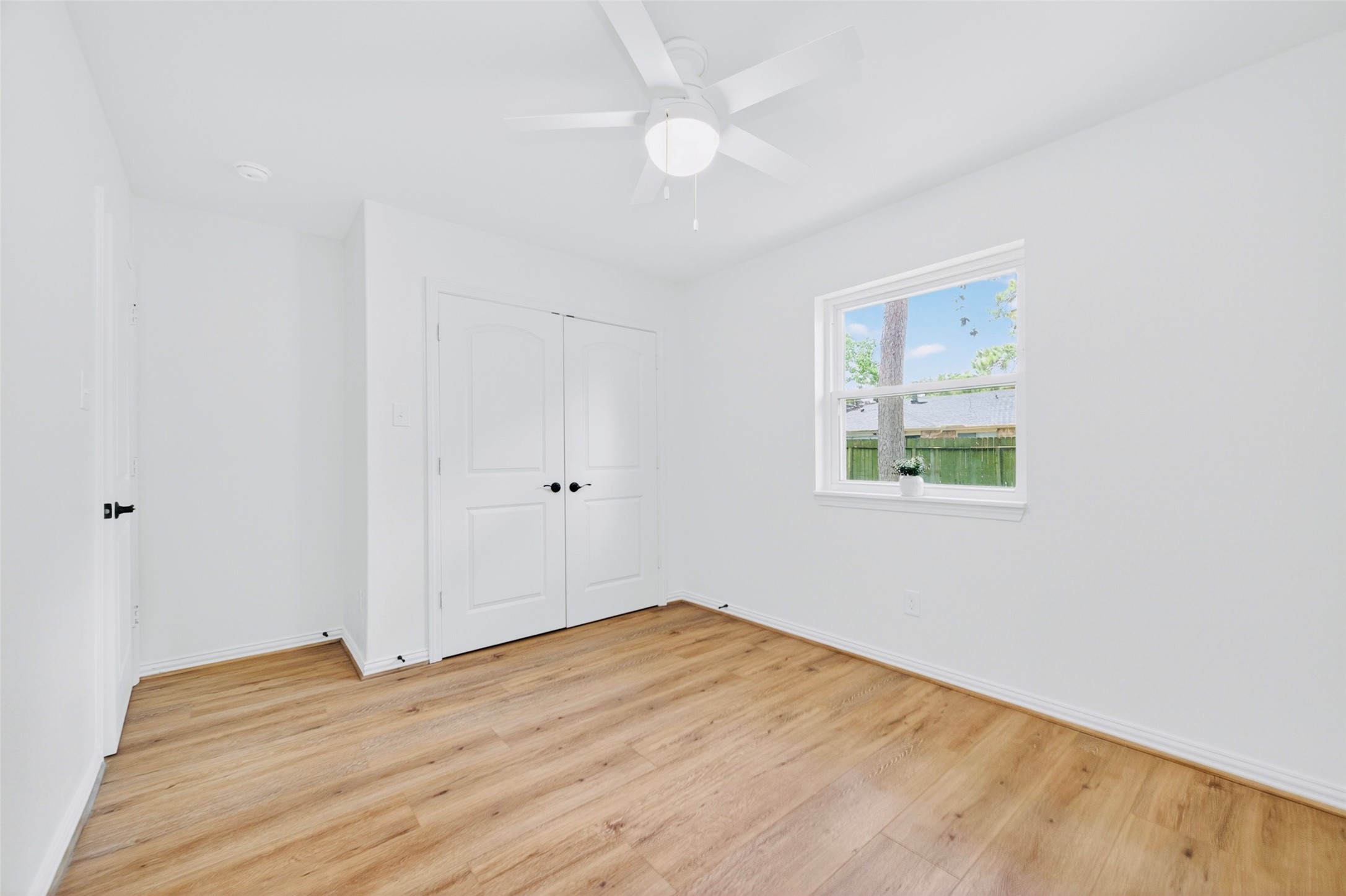 4302 Hickorygate Drive Spring, TX 77373 - Photo 8 of 23 Secondary bedroom one has a window with a view of the backyard