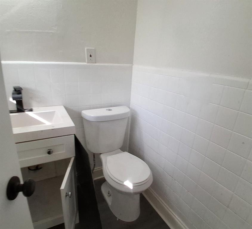 516 Forrest Lane Denison, TX 75021 - Photo 13 of 16 a white toilet sitting next to a white sink