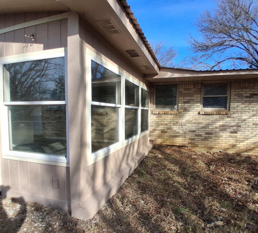 516 Forrest Lane Denison, TX 75021 - Photo 14 of 16 a view of a house with a door