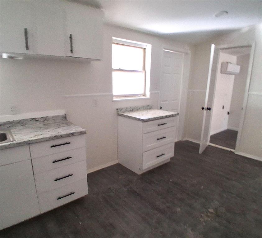 516 Forrest Lane Denison, TX 75021 - Photo 6 of 16 a room with cabinets appliances and a window