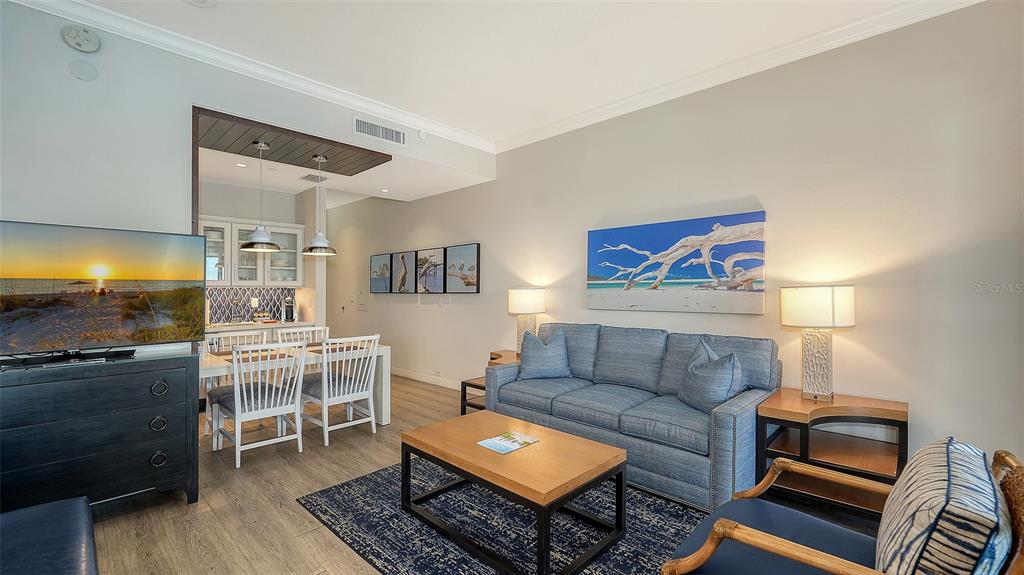 225 Sands Point Road, Unit 6201 Longboat Key, FL 34228 - Photo 11 of 30 a living room with furniture and wooden floor