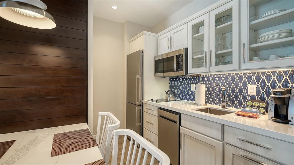 225 Sands Point Road, Unit 6201 Longboat Key, FL 34228 - Photo 13 of 30 a utility room with a sink a washer and dryer