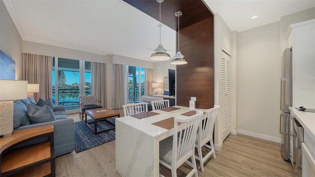 225 Sands Point Road, Unit 6201 Longboat Key, FL 34228 - Photo 15 of 30 a living room with furniture and wooden floor