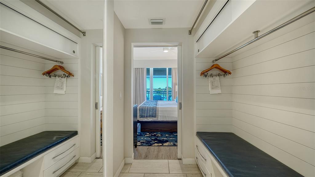 225 Sands Point Road, Unit 6201 Longboat Key, FL 34228 - Photo 17 of 30 a bathroom with a bathtub and shower