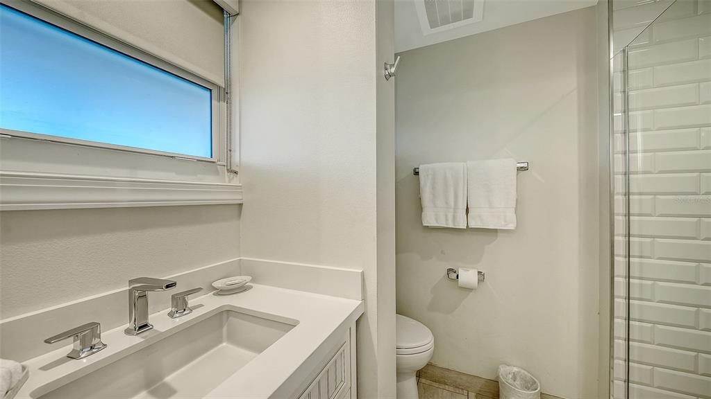225 Sands Point Road, Unit 6201 Longboat Key, FL 34228 - Photo 20 of 30 a bathroom with a sink toilet and vanity