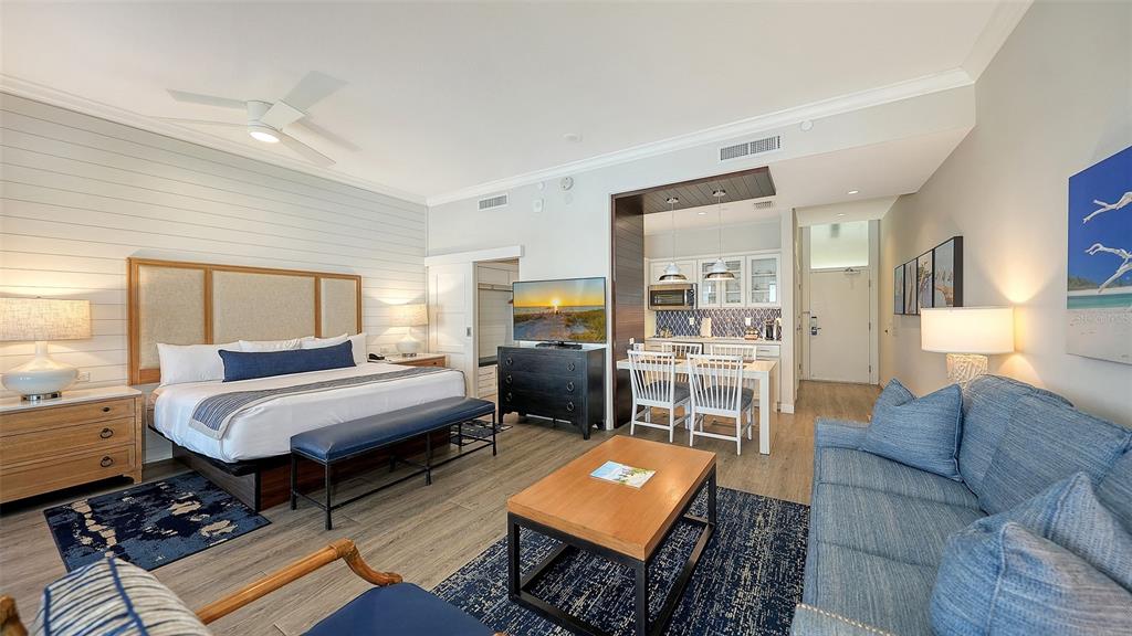 225 Sands Point Road, Unit 6201 Longboat Key, FL 34228 - Photo 5 of 30 a bedroom with furniture and a fireplace