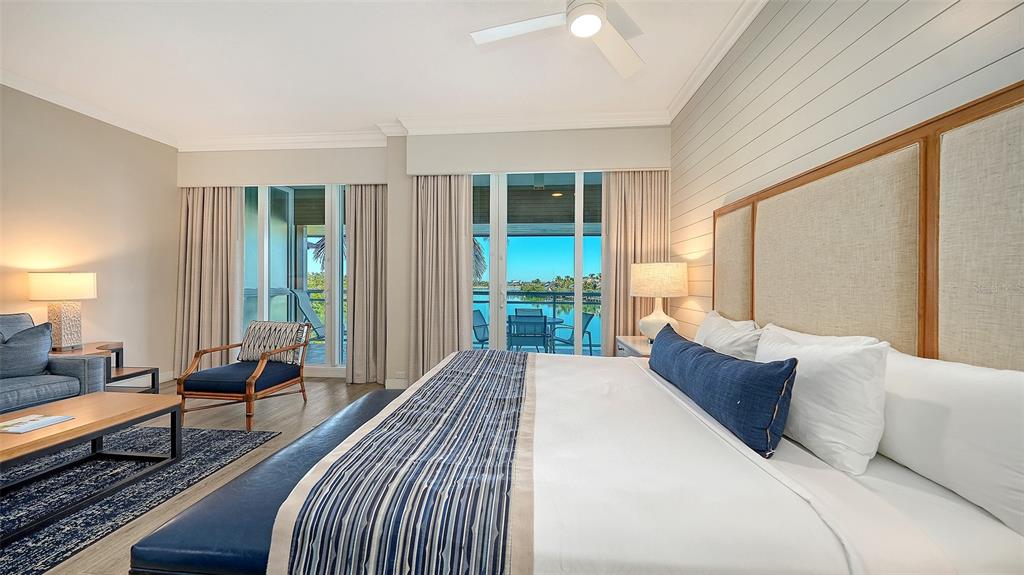 225 Sands Point Road, Unit 6201 Longboat Key, FL 34228 - Photo 7 of 30 a spacious bedroom with a large bed and a large window