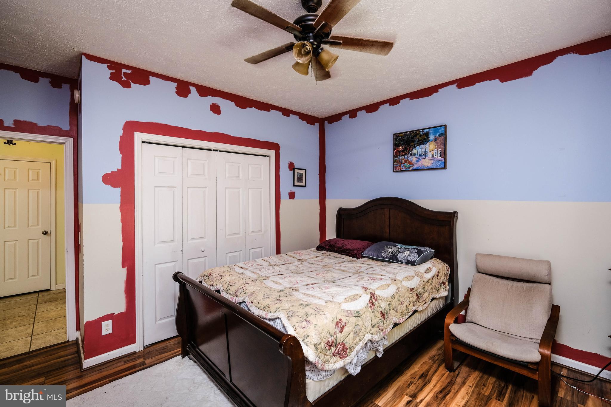 1195 Shangri-La Road Bentonville, VA 22610 - Photo 55 of 64 a bedroom with a bed and a chandelier