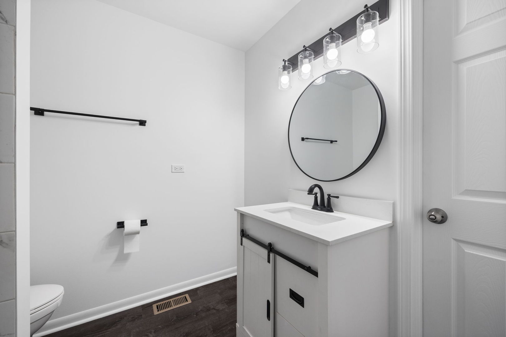 2229 Kensington Drive Schaumburg, IL 60169 - Photo 12 of 14 a bathroom with a sink and a mirror