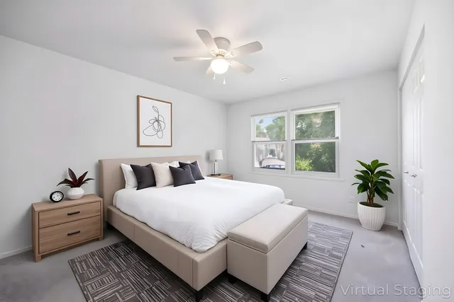 a bedroom with a large bed and a window