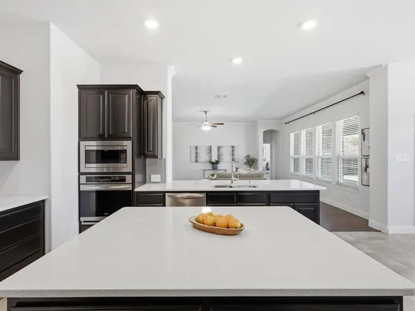 a kitchen with a appliances and cabinets