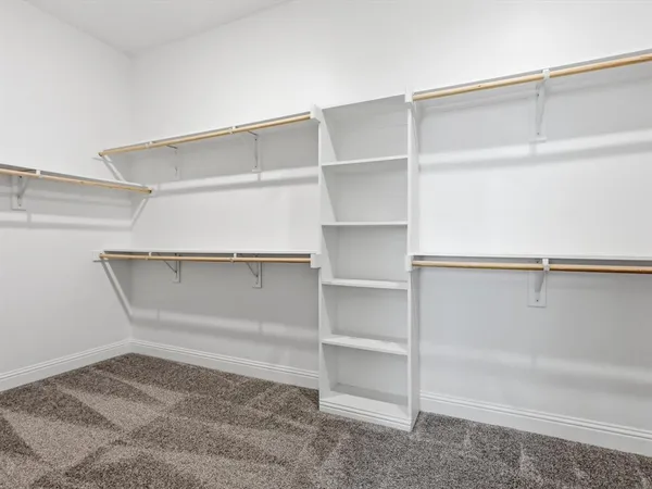 a view of an empty walk in closet