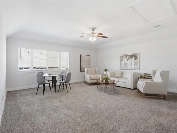 a living room with furniture and a table