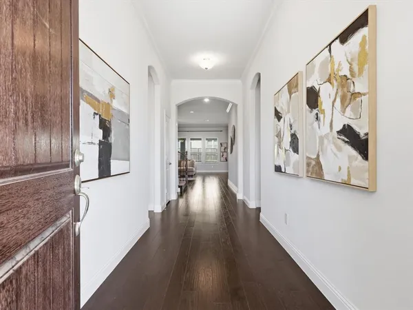 a hallway with wooden floor