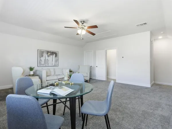 a dining room with furniture and window