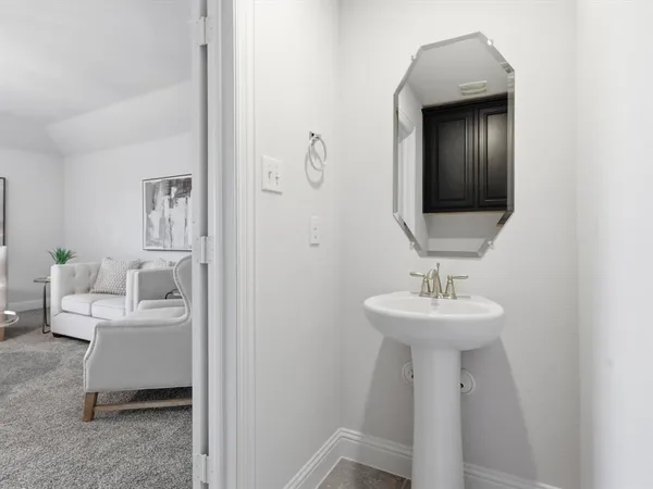 a bathroom with a sink and mirror