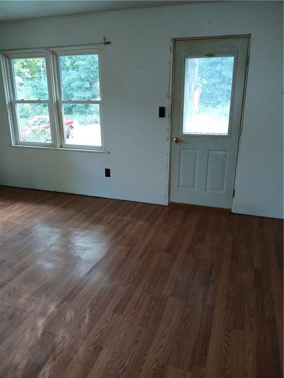 660 Methodist Road Greenville, PA 16125 - Photo 3 of 27 a view of an empty room with wooden floor and a window
