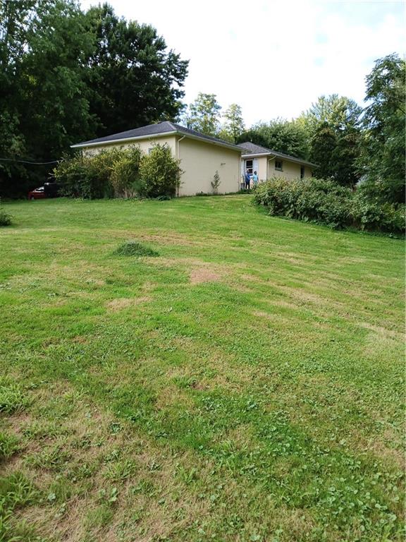 660 Methodist Road Greenville, PA 16125 - Photo 8 of 27 a backyard of a house with lots of green space and fountain