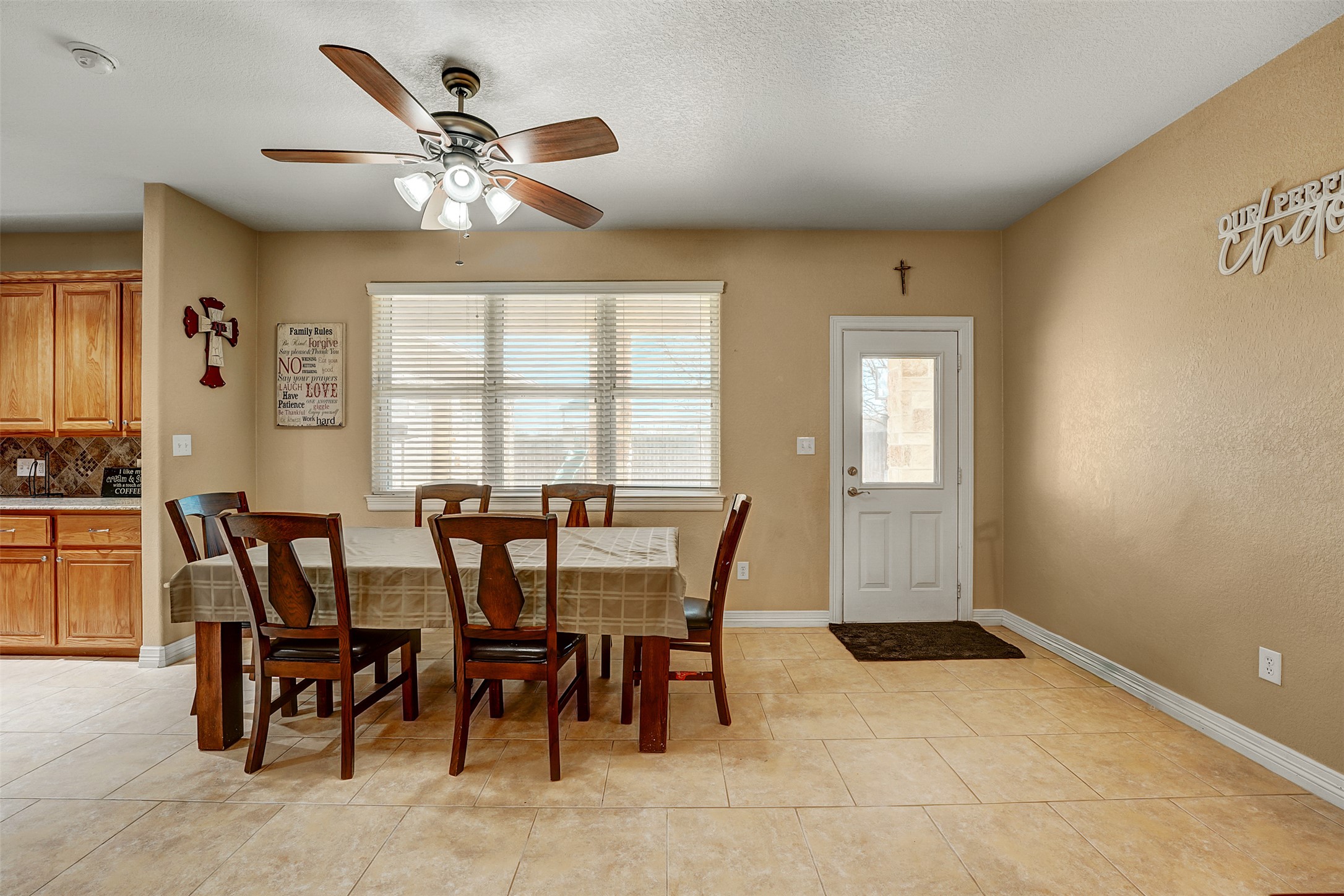 100 Magan Lane Jarrell, TX 76537 - Photo 14 of 32 a view of a dining room with furniture and chandelier