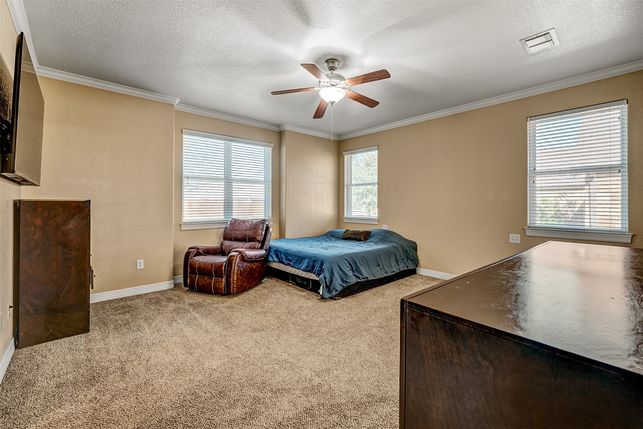 100 Magan Lane Jarrell, TX 76537 - Photo 17 of 32 a bedroom with furniture and window