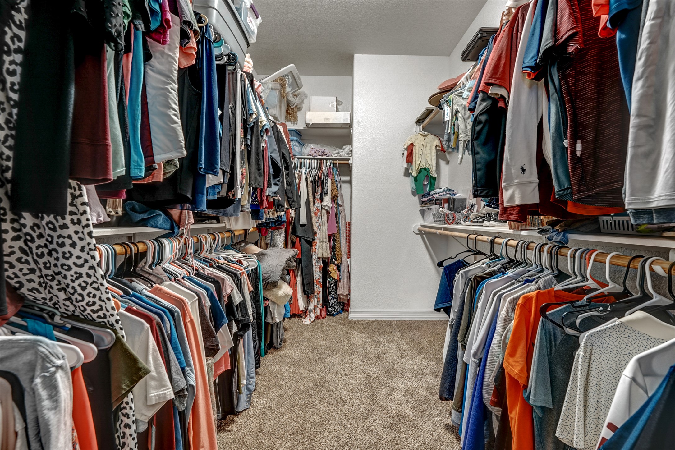 100 Magan Lane Jarrell, TX 76537 - Photo 21 of 31 a view of walk in closet with clothes