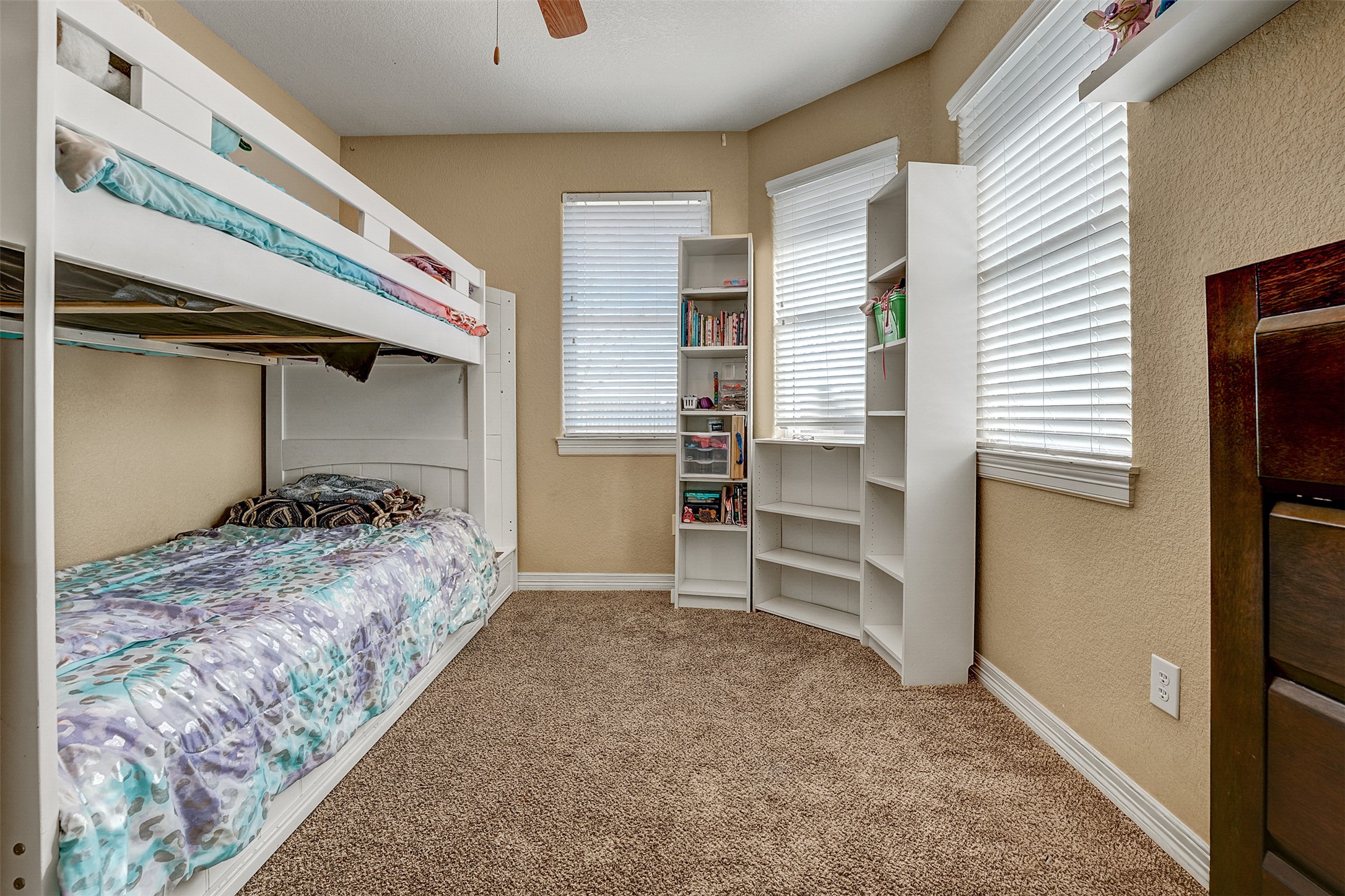 100 Magan Lane Jarrell, TX 76537 - Photo 23 of 31 a bedroom with a bed and a walk in closet