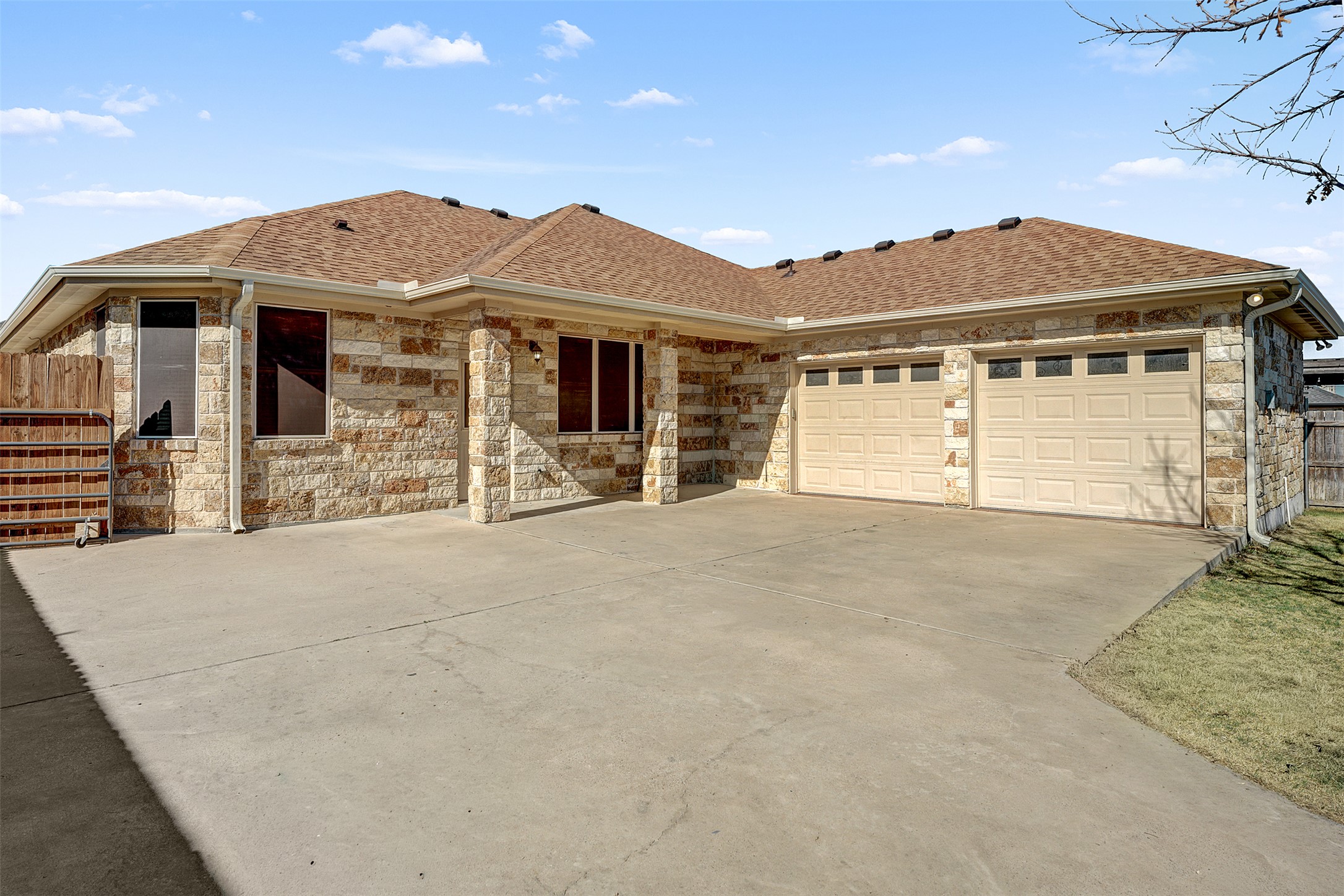 100 Magan Lane Jarrell, TX 76537 - Photo 26 of 31 a front view of a house with a yard and garage
