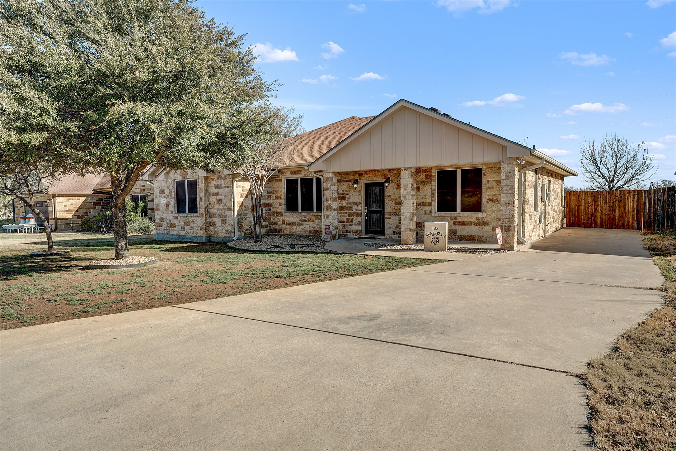100 Magan Lane Jarrell, TX 76537 - Photo 6 of 32 a front view of a house with yard and trees in the background
