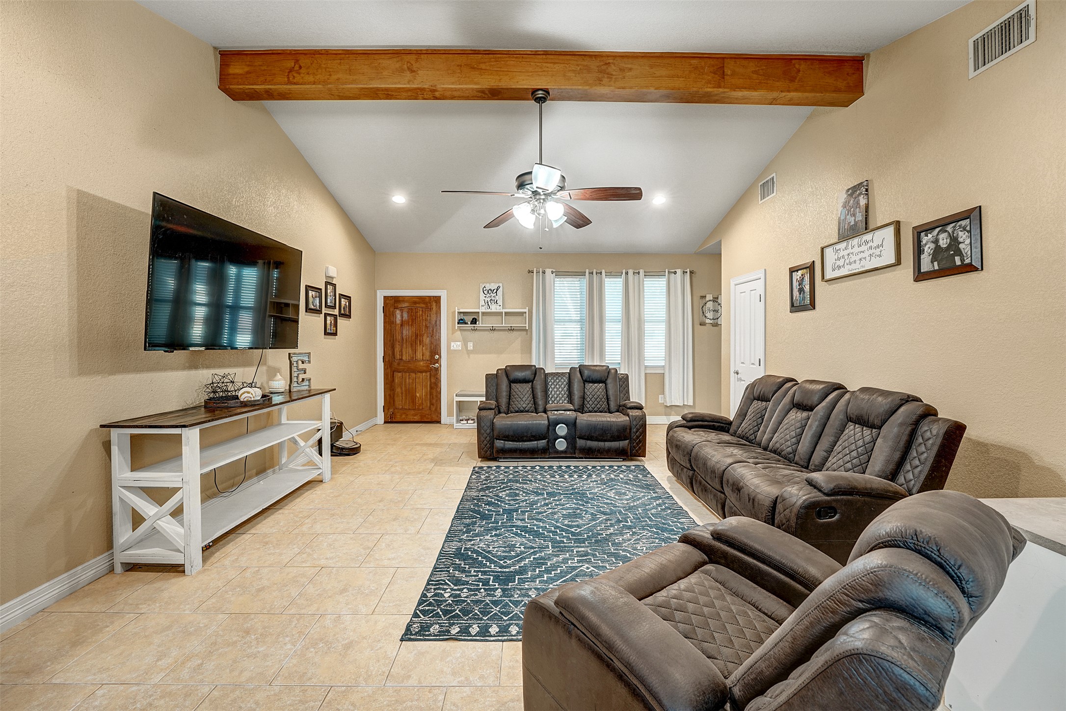 100 Magan Lane Jarrell, TX 76537 - Photo 7 of 32 a living room with furniture and a flat screen tv
