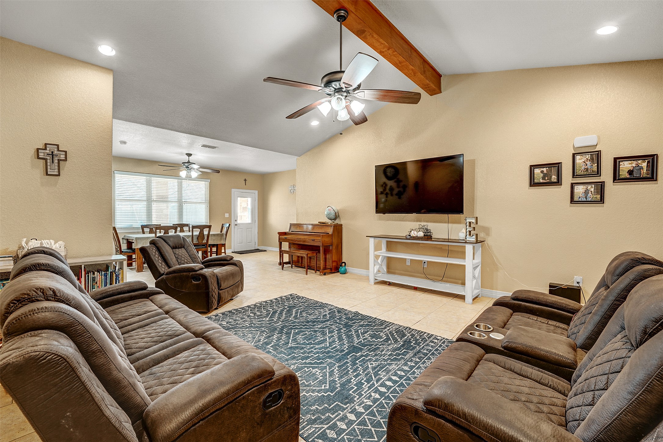100 Magan Lane Jarrell, TX 76537 - Photo 8 of 32 a living room with furniture and a flat screen tv