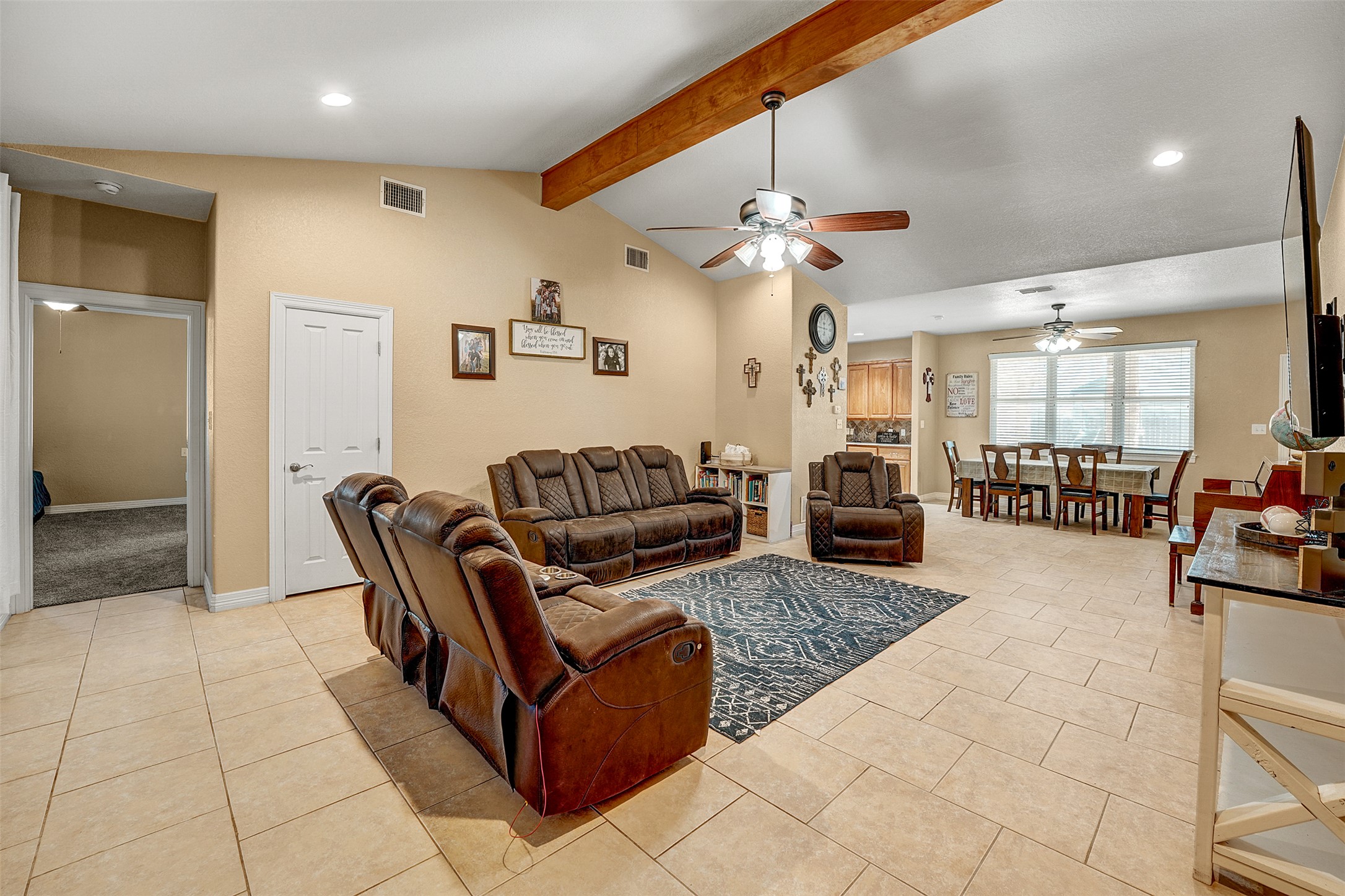 100 Magan Lane Jarrell, TX 76537 - Photo 9 of 32 a living room with furniture a dining table and a fireplace