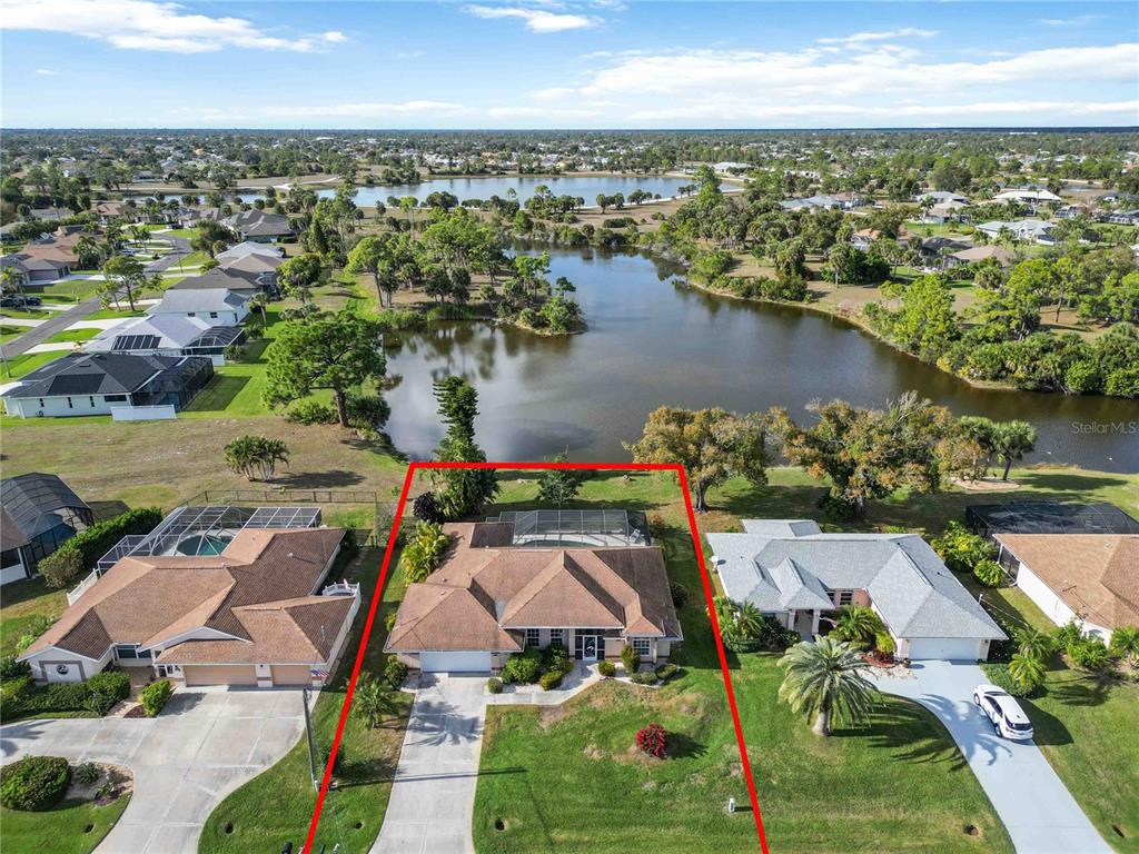 222 Sportsman Road Rotonda West, FL 33947 - Photo 11 of 54 an aerial view of residential houses with outdoor space and lake view