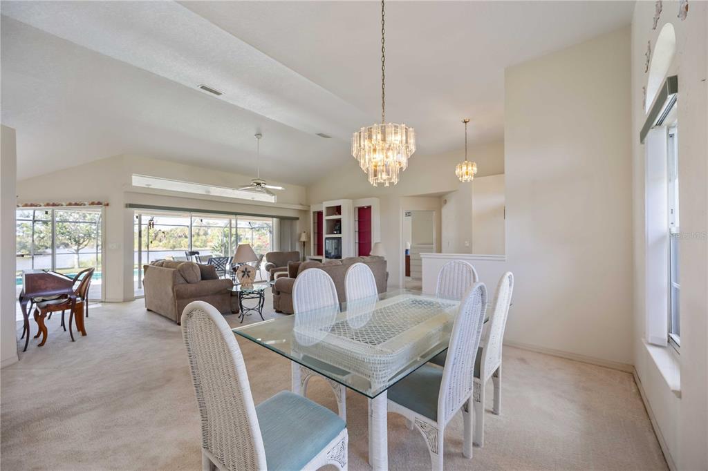 222 Sportsman Road Rotonda West, FL 33947 - Photo 15 of 54 a view of a dining room with furniture window and outside view