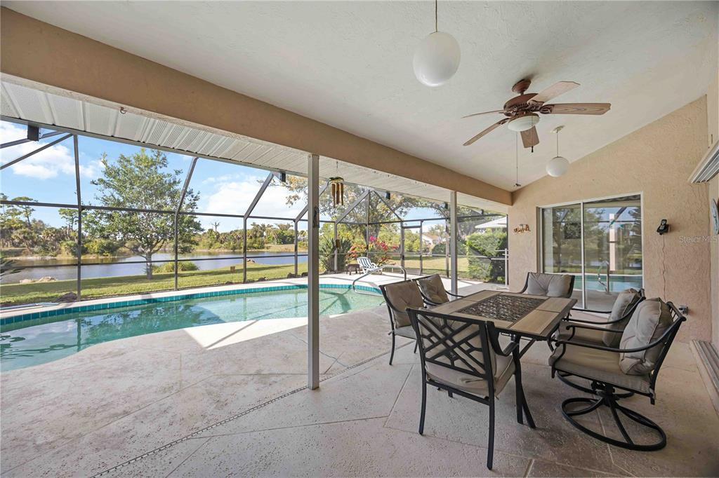 222 Sportsman Road Rotonda West, FL 33947 - Photo 21 of 54 a view of a dining room with furniture window and outside view