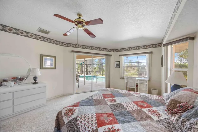 a bedroom with bed and window