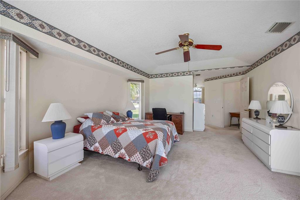 222 Sportsman Road Rotonda West, FL 33947 - Photo 24 of 54 a bedroom with bed and window