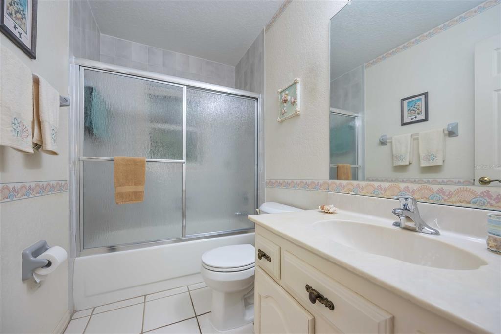 222 Sportsman Road Rotonda West, FL 33947 - Photo 33 of 54 a bathroom with a sink toilet and shower