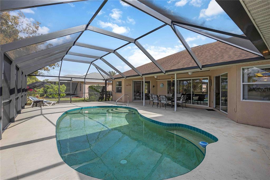 222 Sportsman Road Rotonda West, FL 33947 - Photo 34 of 54 a view of a swimming pool with seating space