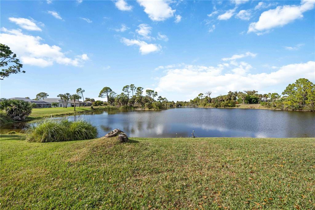 222 Sportsman Road Rotonda West, FL 33947 - Photo 37 of 54 a view of a lake with houses in the back